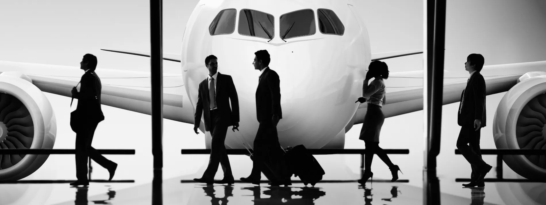 Business traveler with a suitcase at an airport