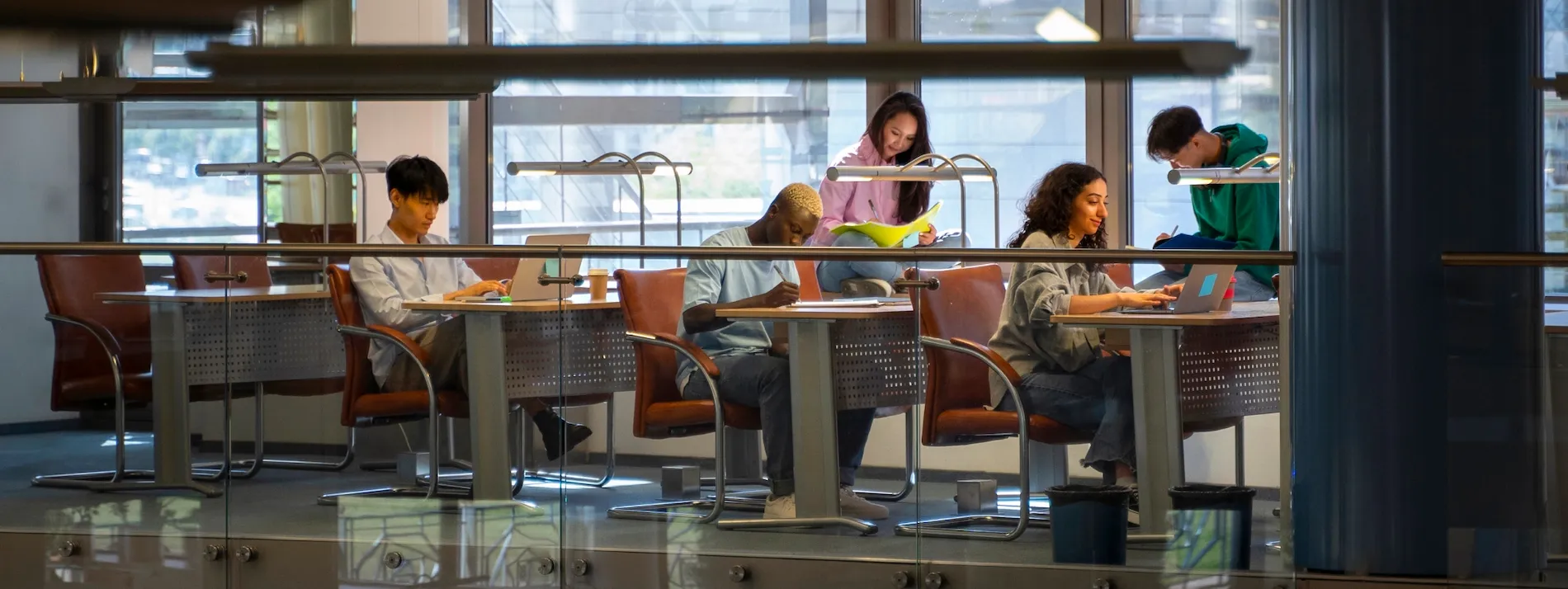 Student working on applications at a laptop
