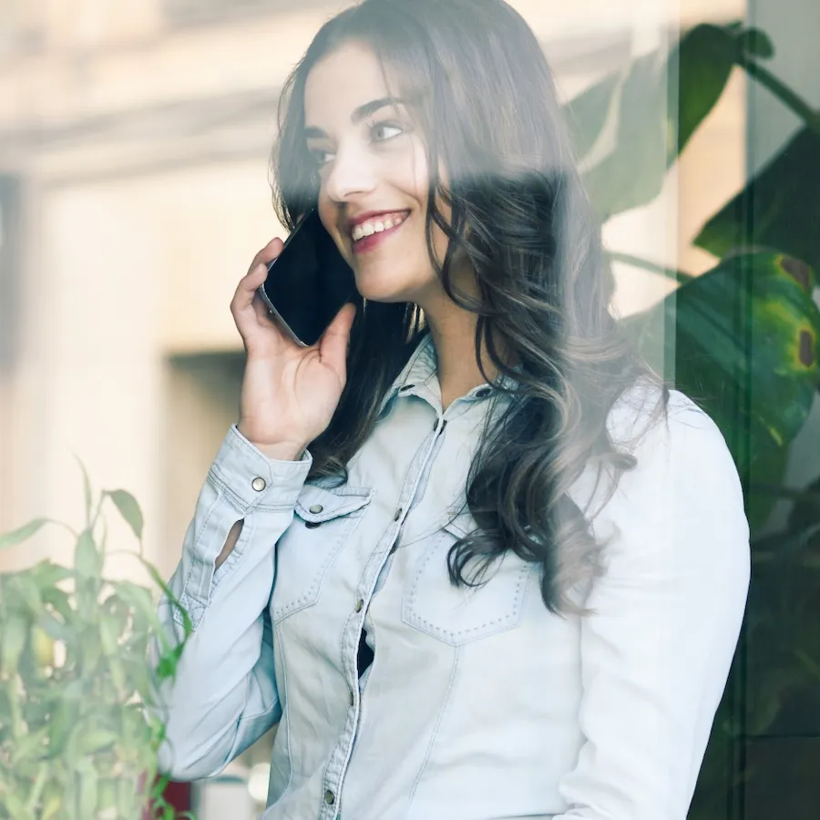 Event planner on a phone call while checking the event plan