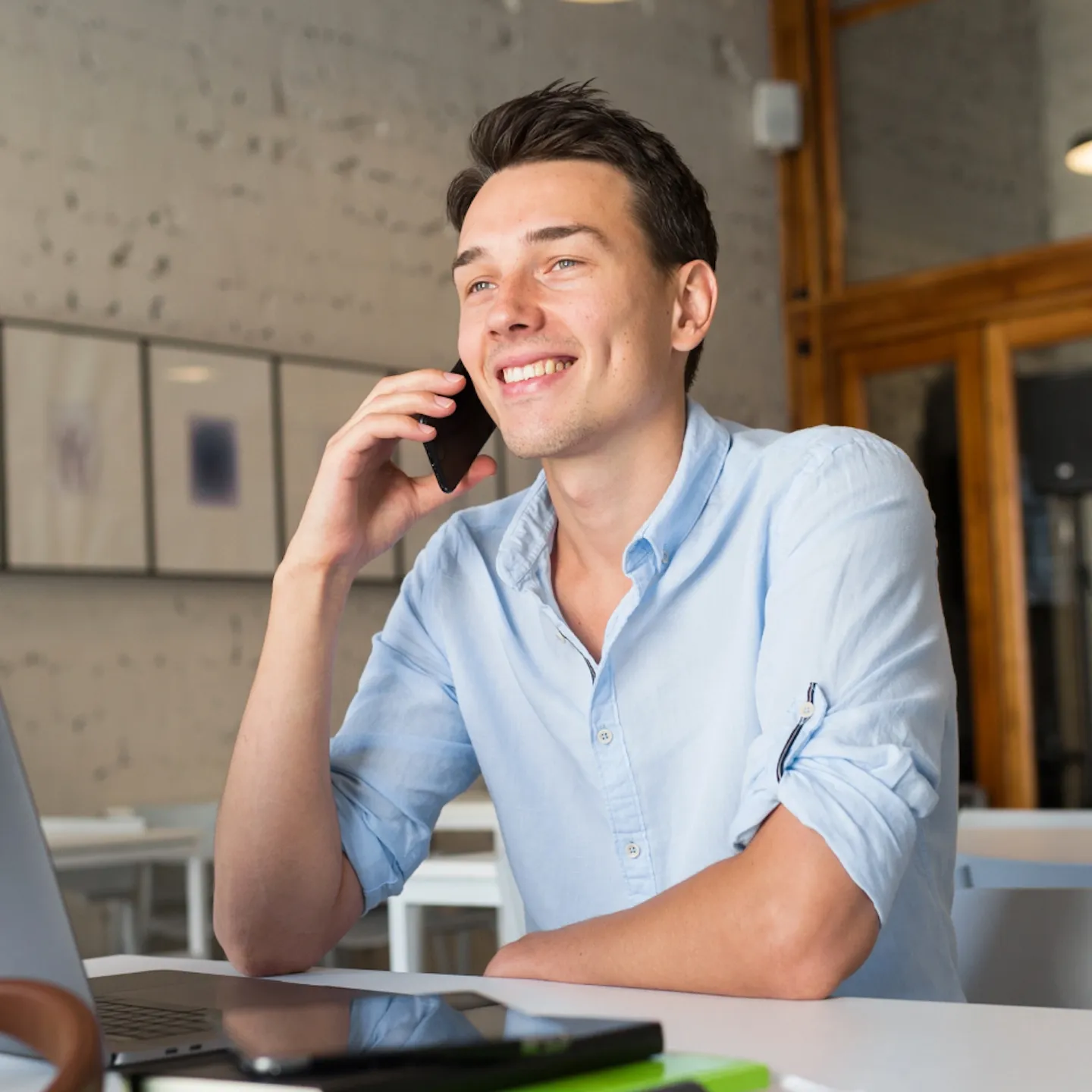 Logistics coordinator on a phone call in a warehouse